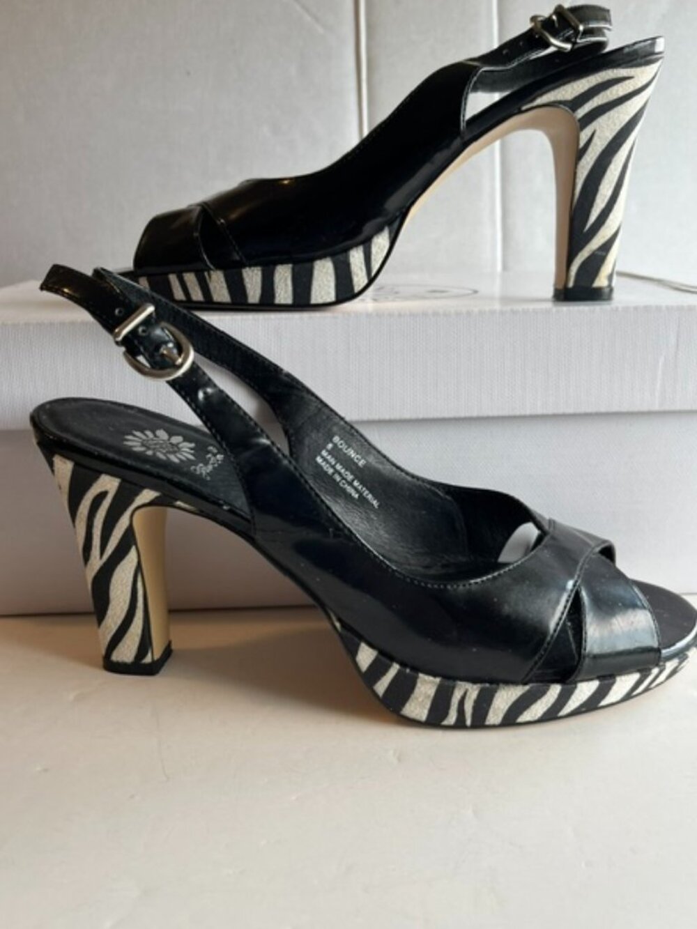 Yellow box heeled slingback sandals.
